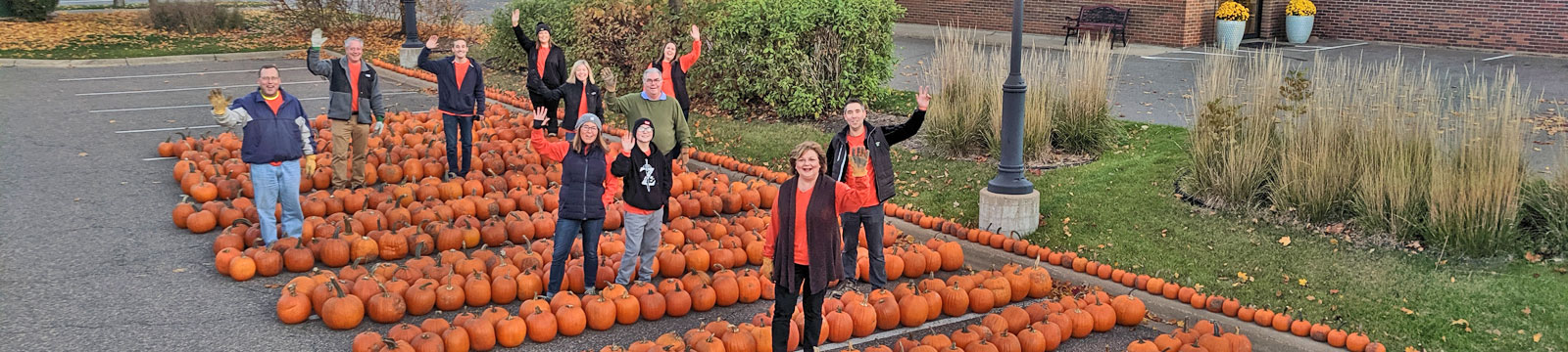 image of a group of Gateway Bank associates waving at the annual fall festival